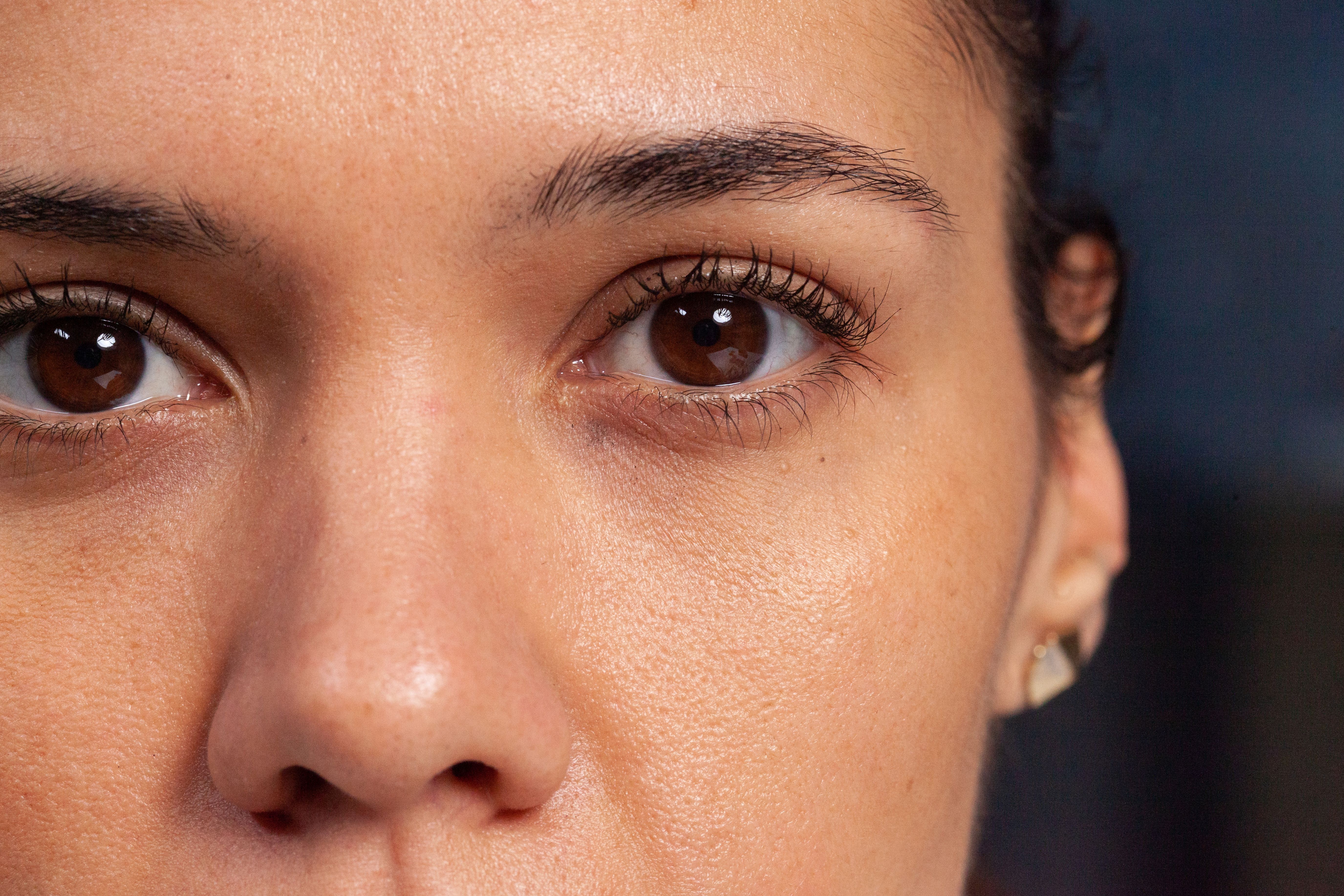 Close-up of a woman's eyes, showing detailed view of the iris and pupil.